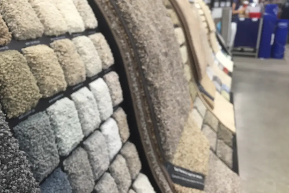 Choosing the Best Carpet for Your Home: A Comprehensive Guide - Carpet samples in a showroom