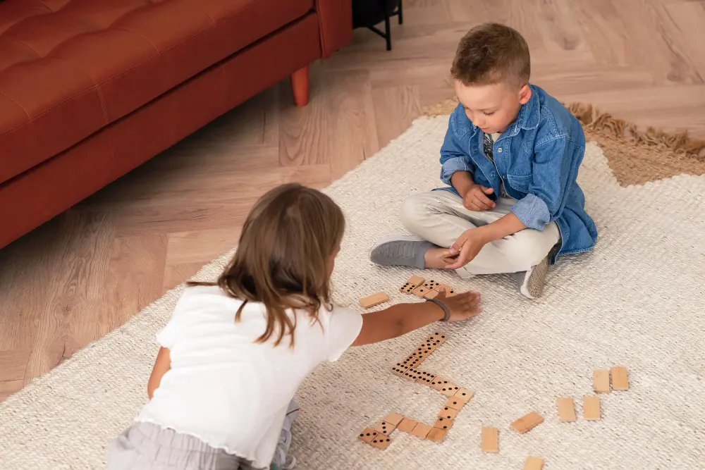 kids playing on top of a carpet
